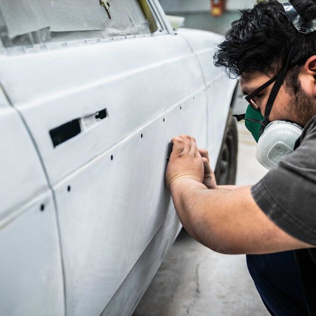 automotive student working on car