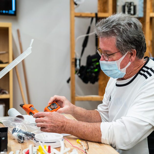 image of electrical student working with a tool