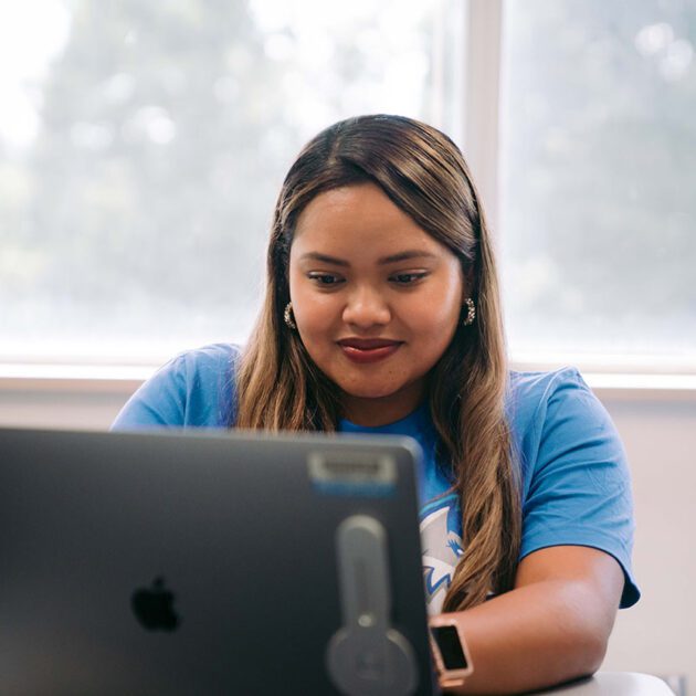 image of staff member working on laptop