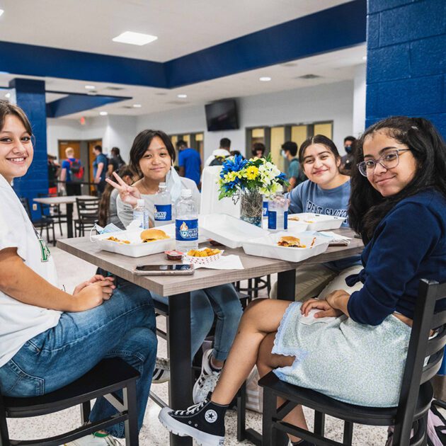 image of students sitting at a table inside blaze grill