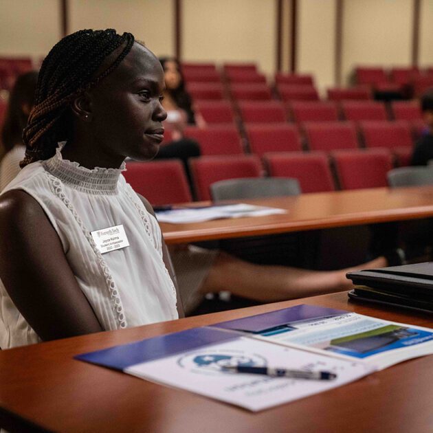 woman sitting inside a conference room