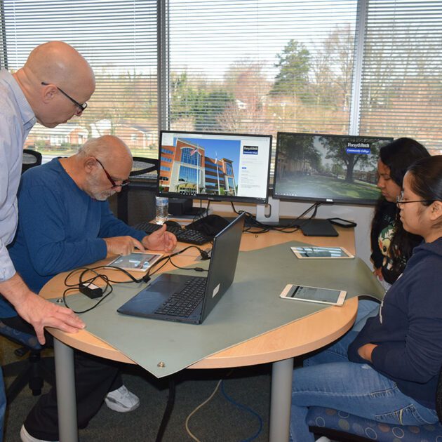 image of IT students working on computer