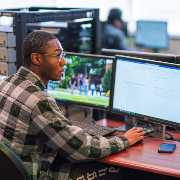 image of IT student working at computer