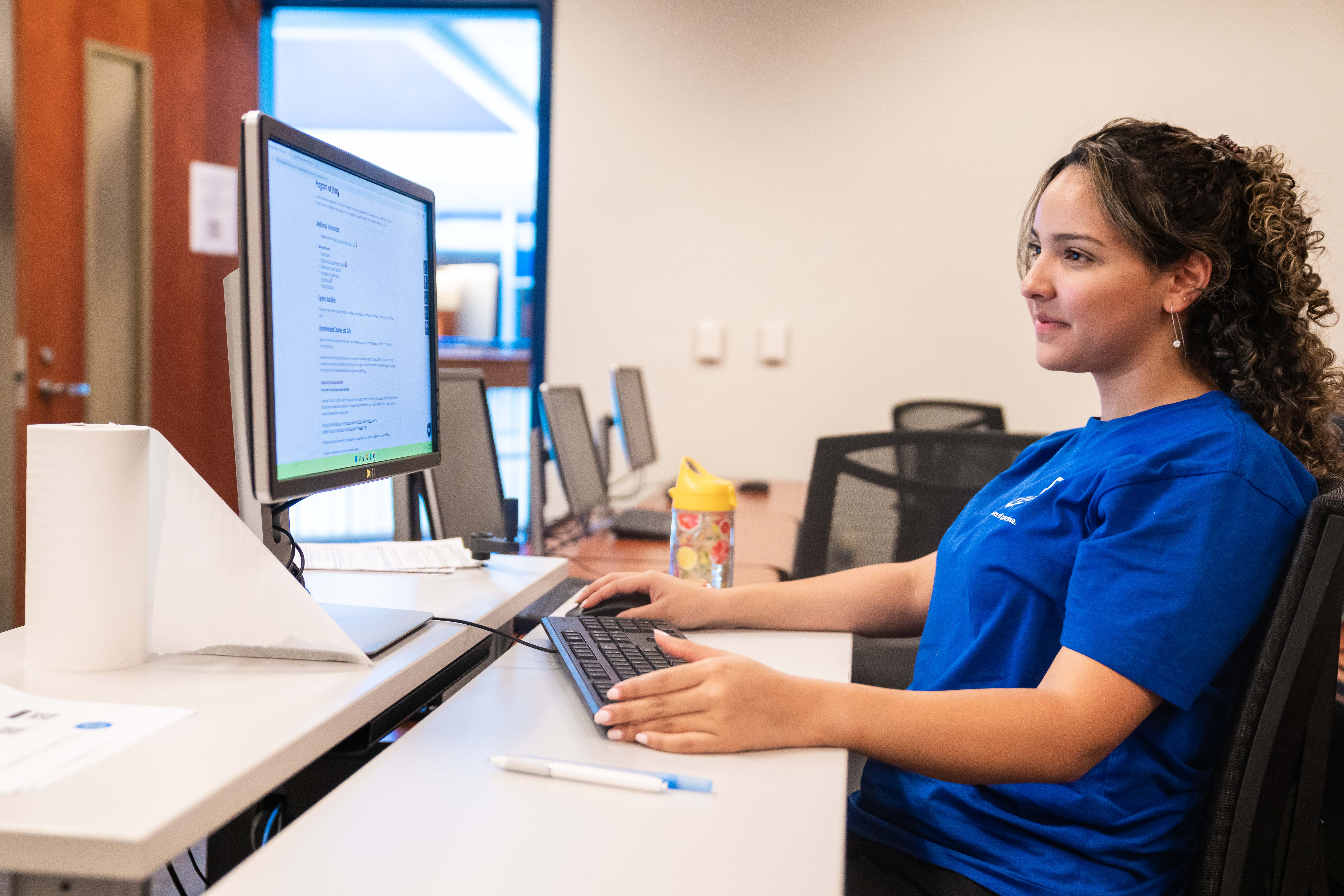 image of female student working on computer