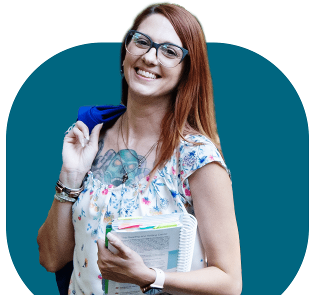 image of female student in front of teal block