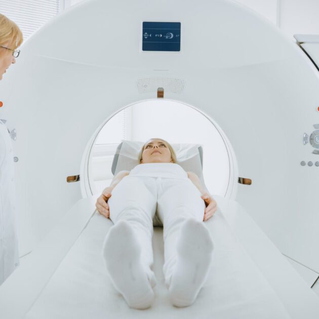 Patient going into a Nuclear Medicine Machine for a scan.