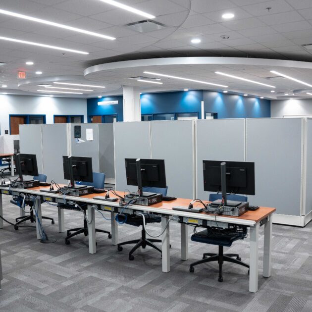 Image of a space with multiple desks and computers
