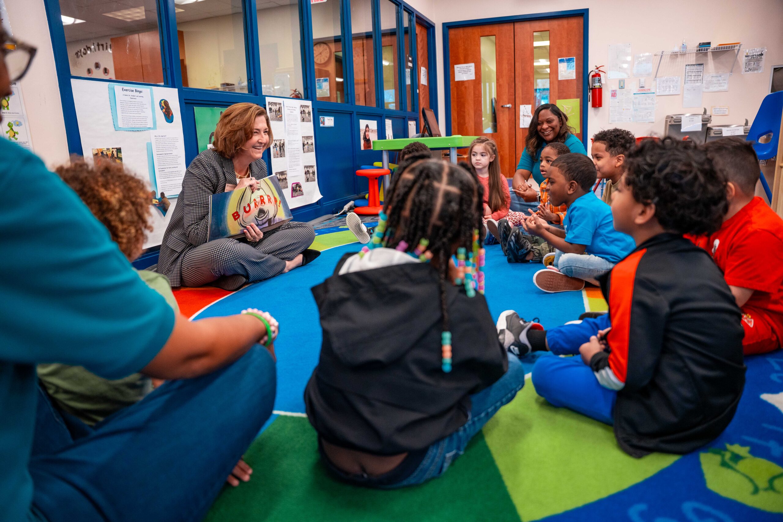 President Spriggs reading to children in the community