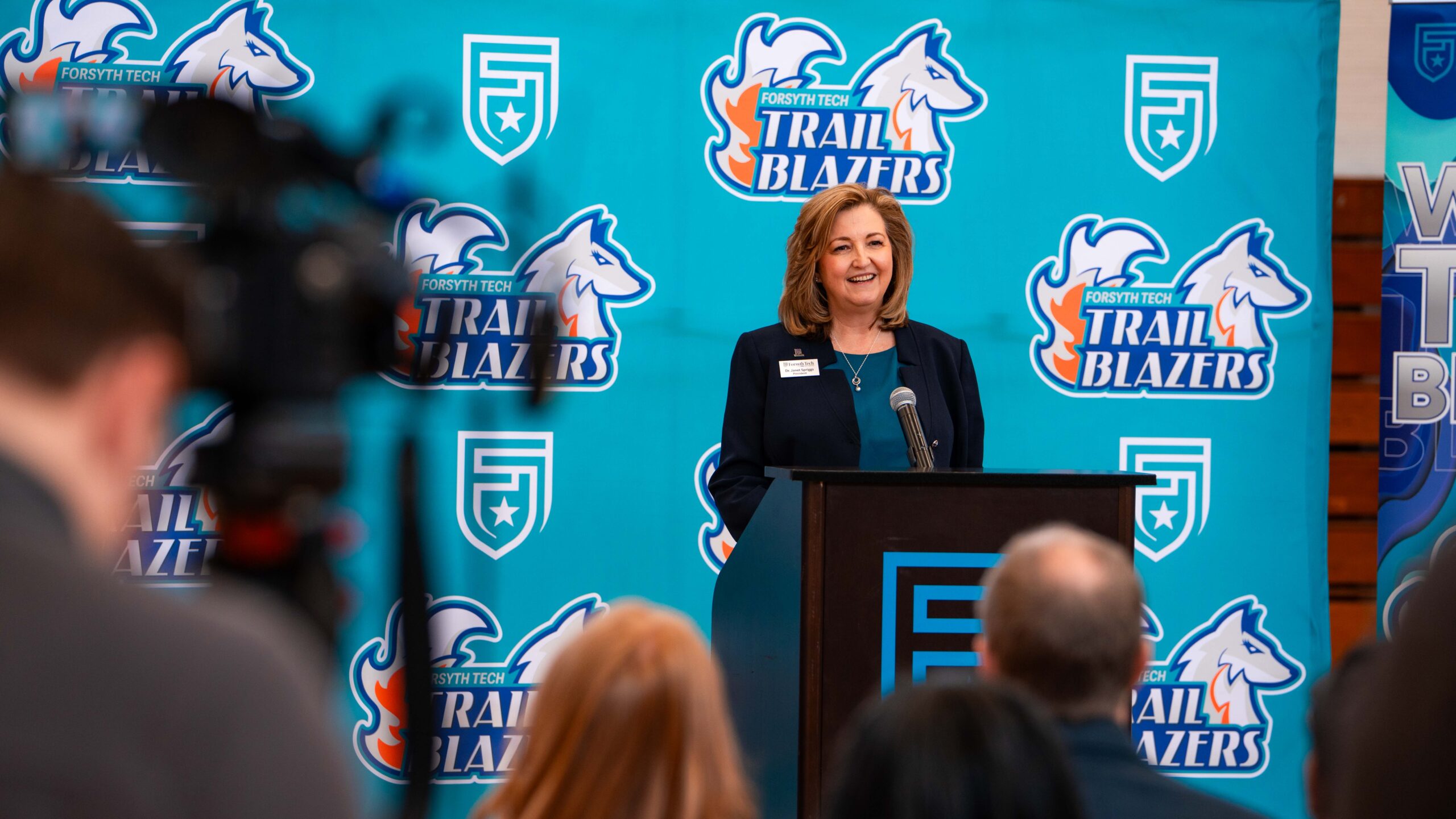 President Spriggs stepping to the podium